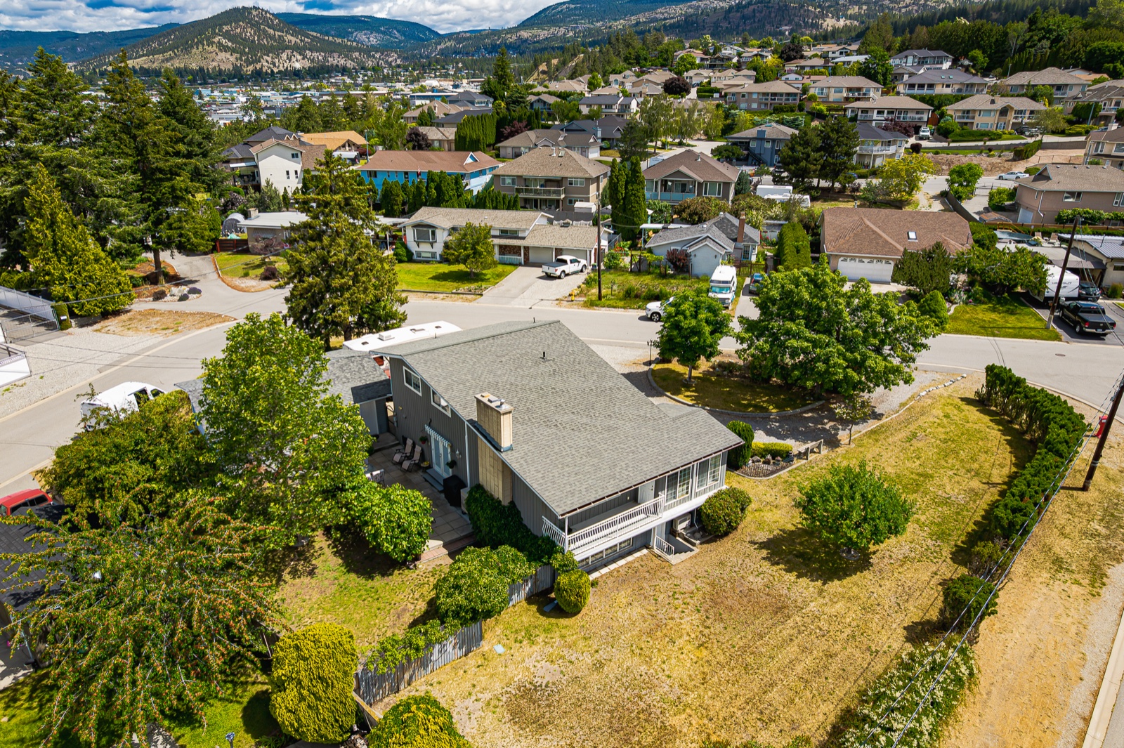 Aerial view of 125 Corry Place showing the large lot and Penticton setting