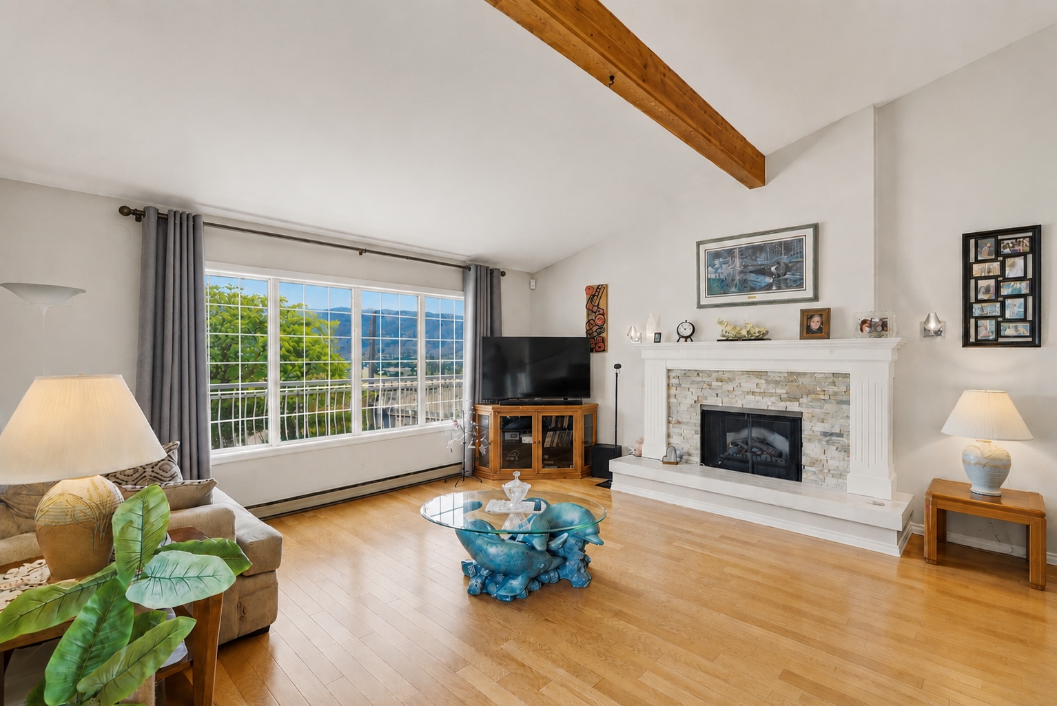 Living room with fireplace and mountain view