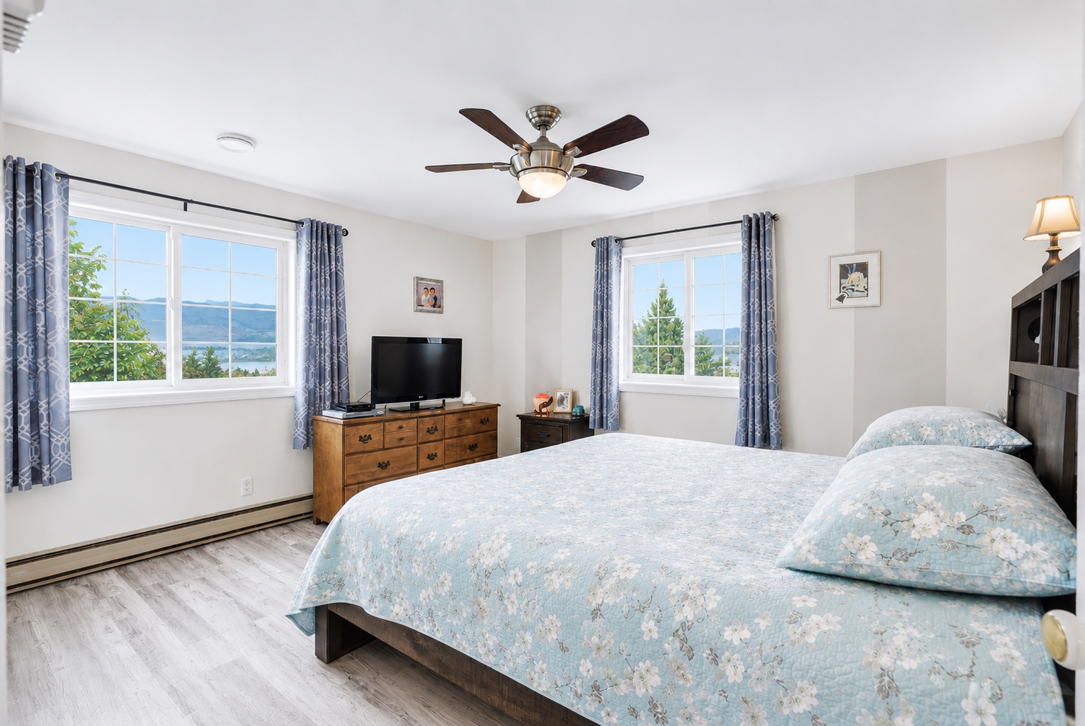 Primary bedroom with windows and view