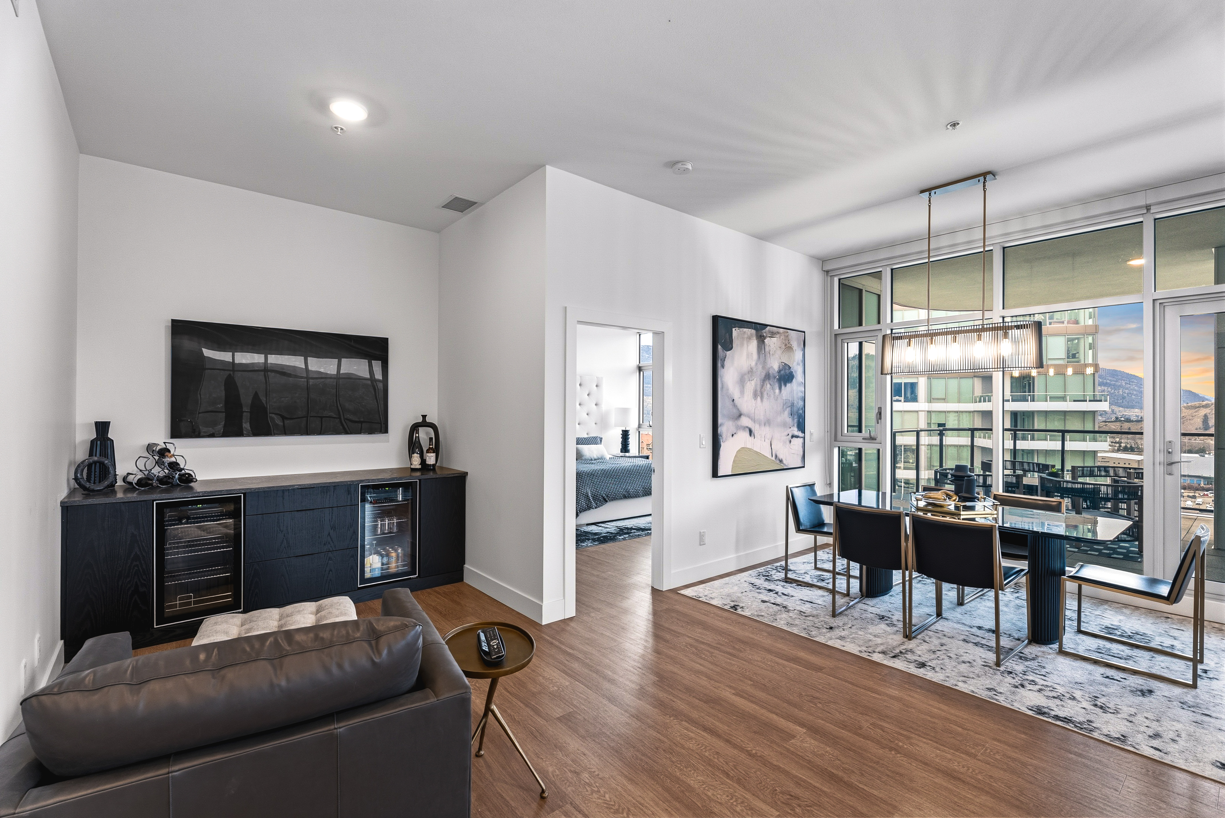 Living area with peek into the primary bedroom