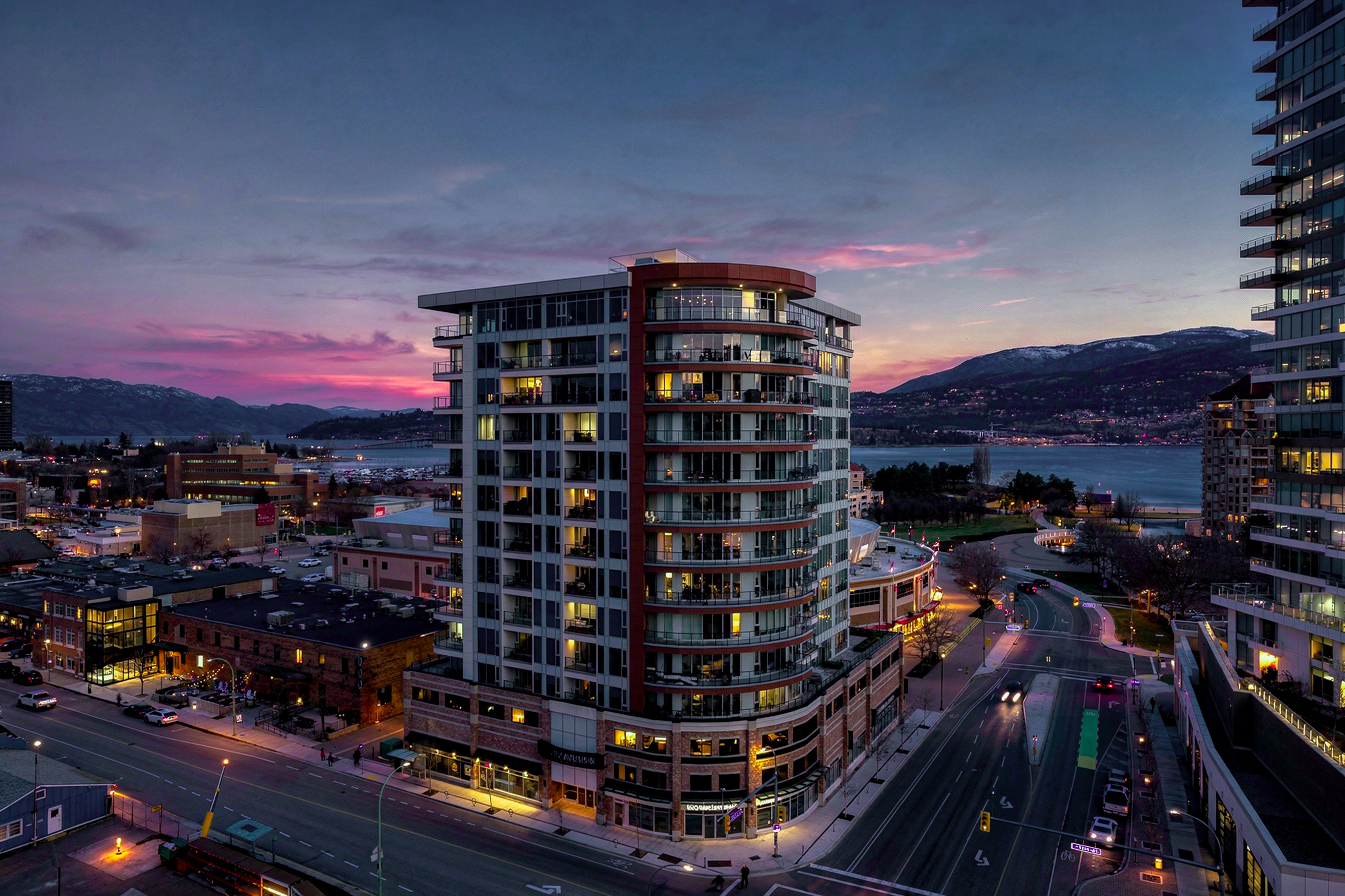 Ellis Parc twilight aerial with lake and mountains