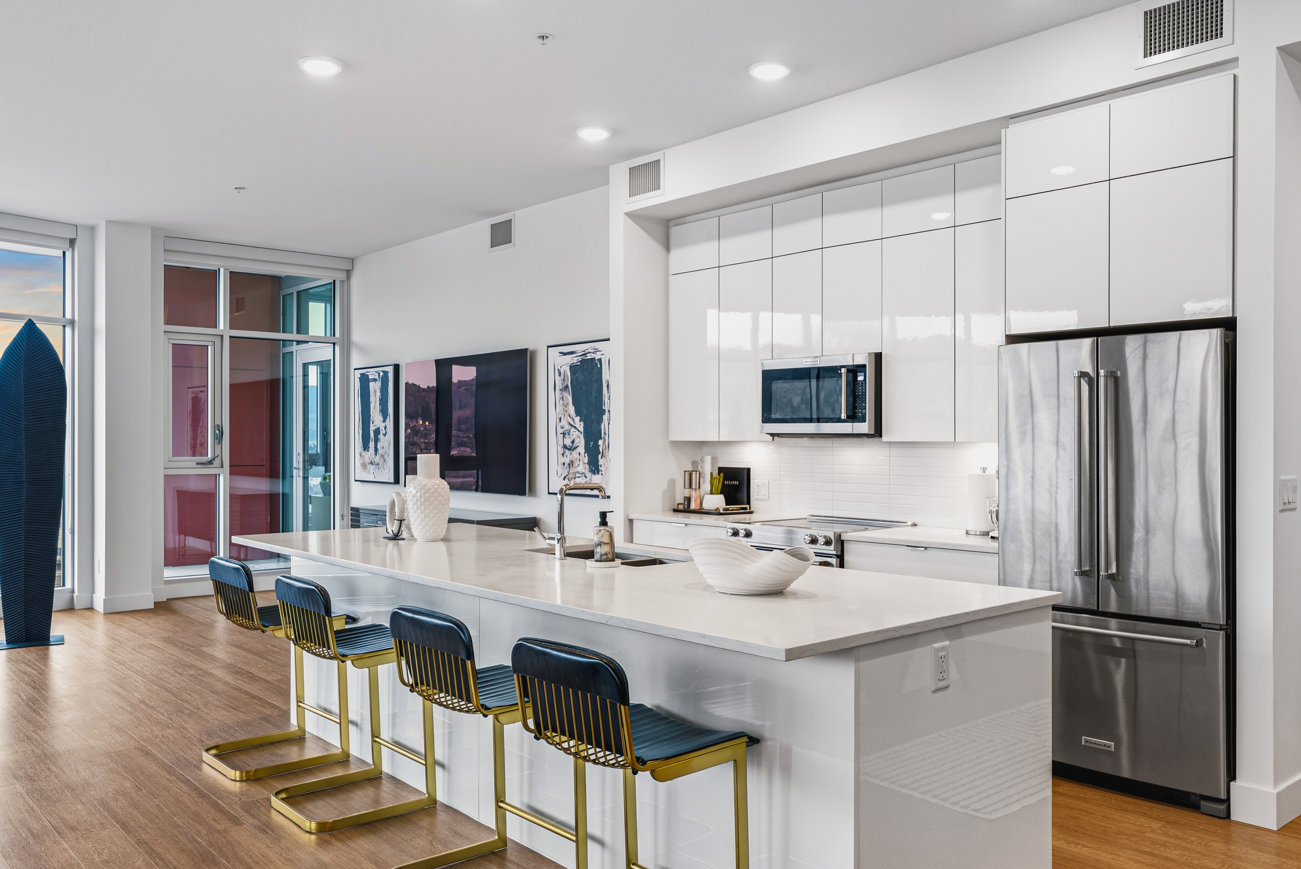 Kitchen island with barstools and balcony