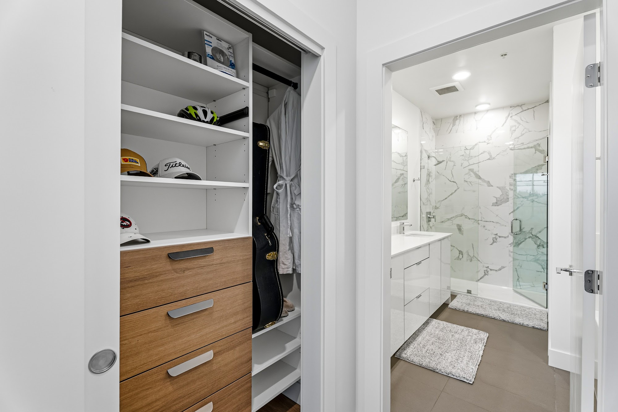 Walk-in closet with custom oak shelving and hanging