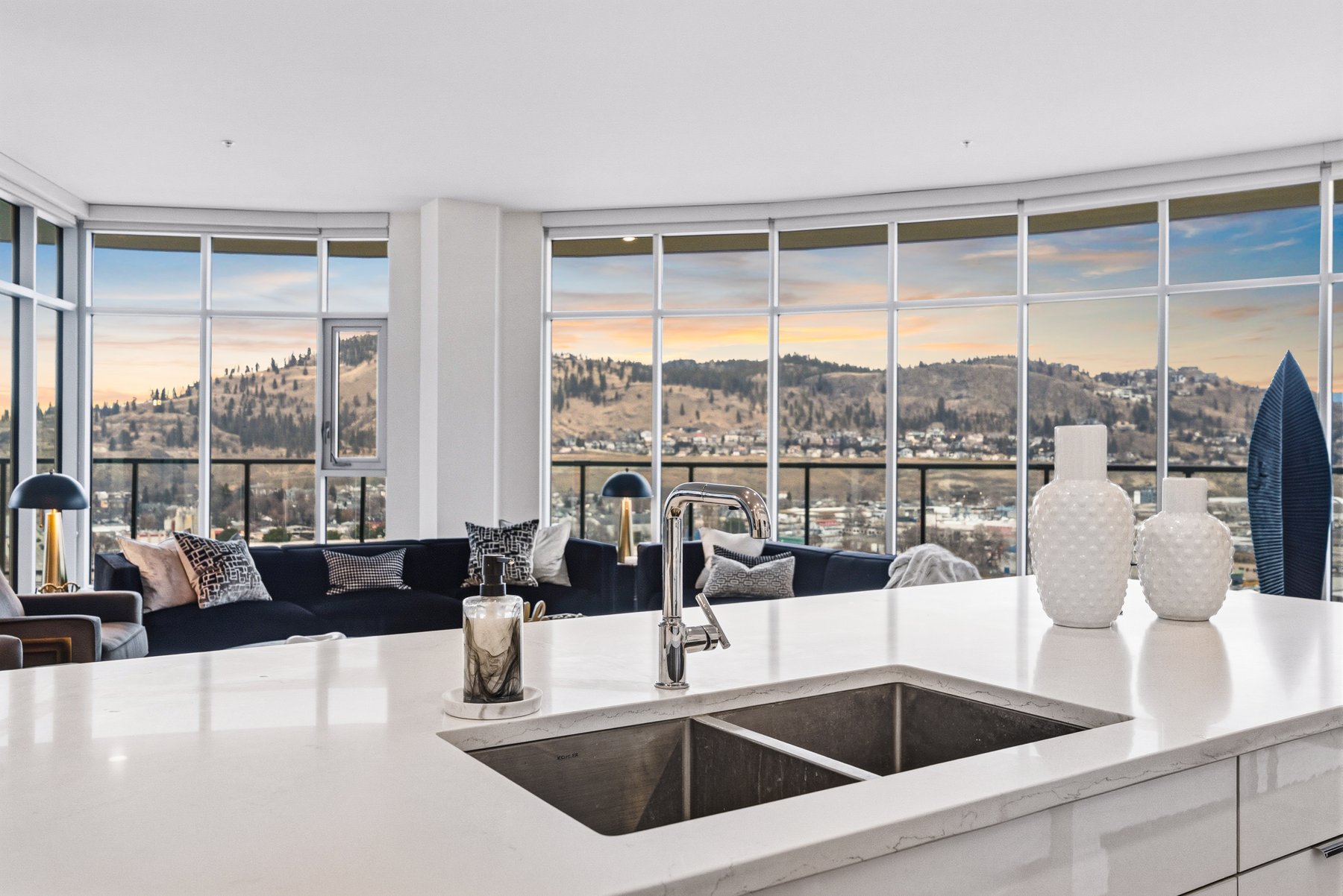 Kitchen island detail with windows and view at twilight