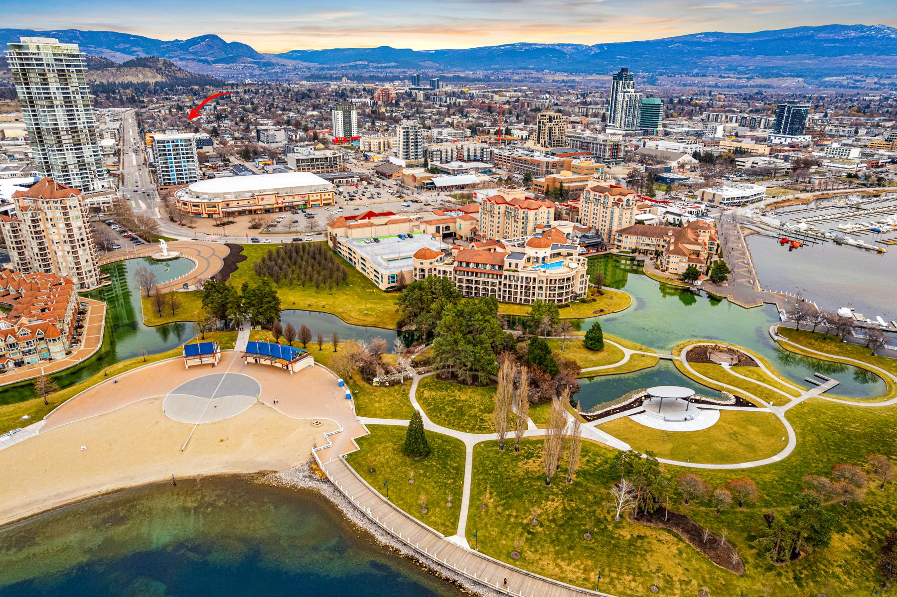 Aerial view of downtown Kelowna's Cultural District, lakefront and Stuart Park from above Ellis Parc