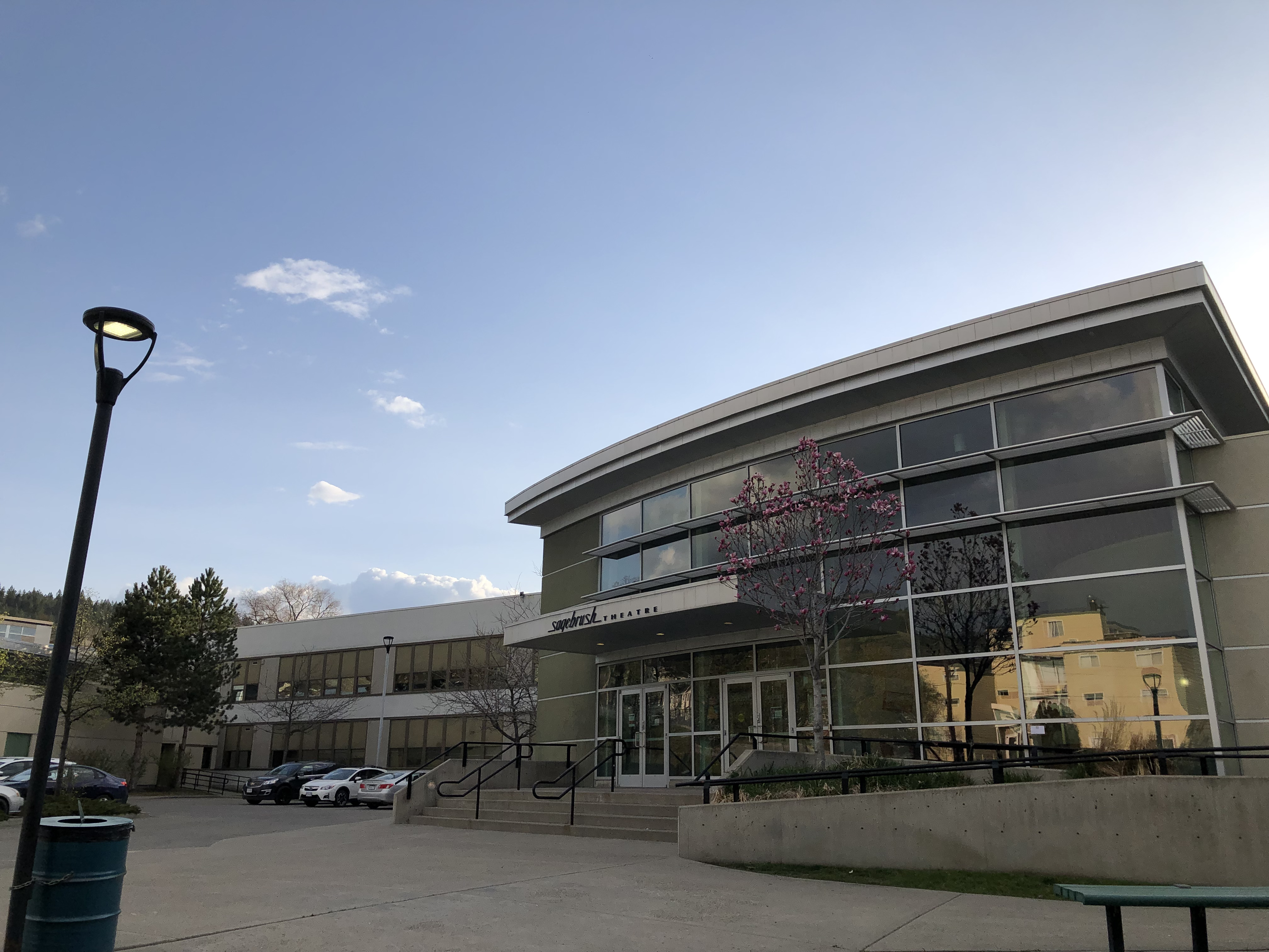 Sagebrush Theatre exterior with cherry blossoms in spring