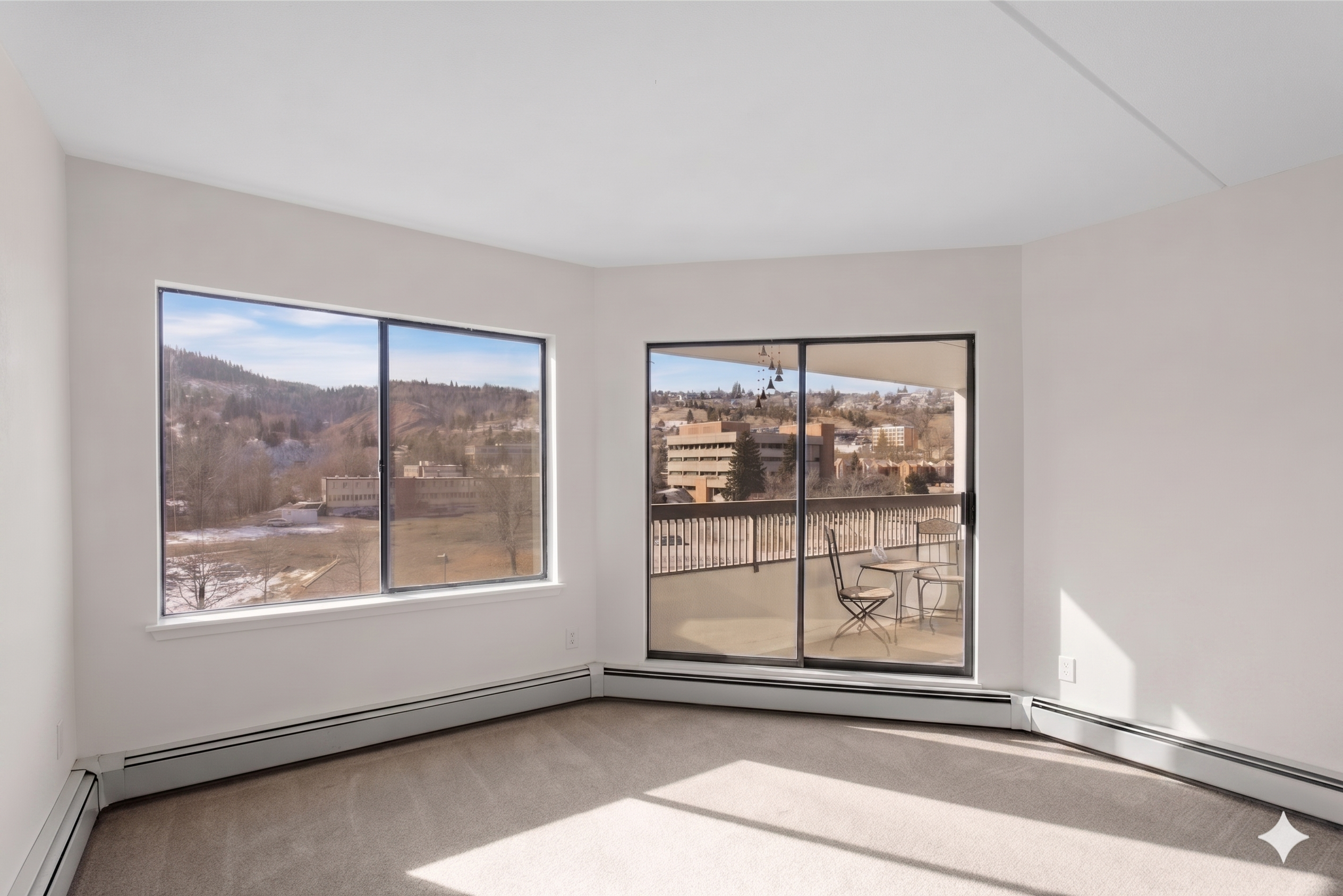 Bedroom window framing the mountains and balcony view